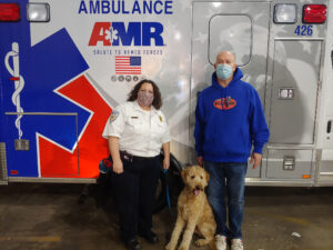 Springfield EMT standing in front of ambulance with dog